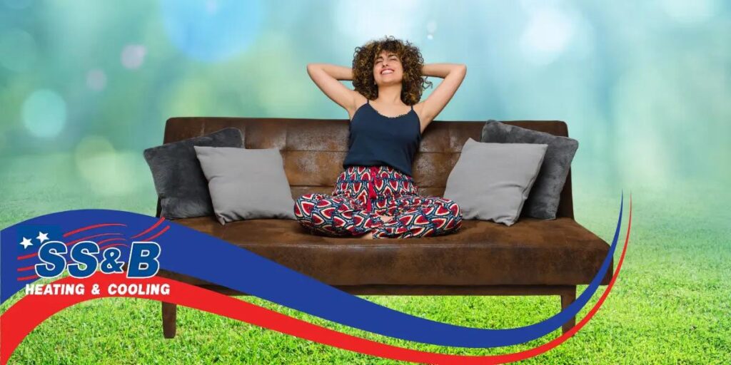 Woman relaxing at home, enjoying the quiet comfort provided by a low-noise HVAC system, free from loud sounds.