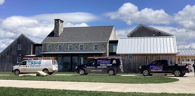 SS&B service vehicles parked outside a custom-built home in Springfield, Missouri